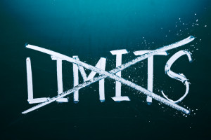 Limits crossed out on chalkboard background.