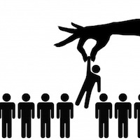 Hand selecting a person from group.