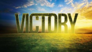 Victory text over grassy landscape and sky.