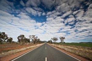 Open road under a cloudy sky.