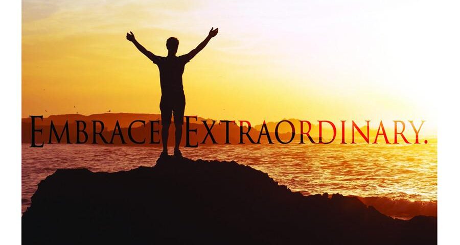 Silhouette embracing sunset with "Embrace Extraordinary.