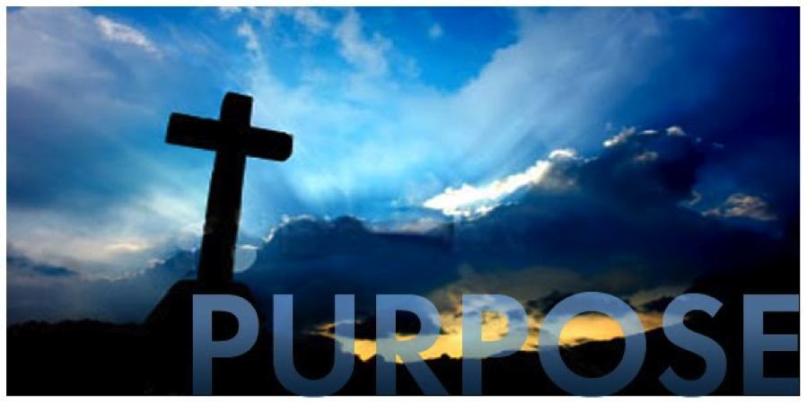 Silhouette of cross against dramatic sky.