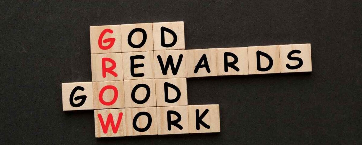 Scrabble tiles forming motivational words about growth and effort.