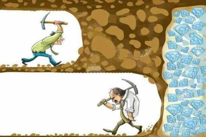 Two men mining, one with a pickaxe and the other with a hammer.